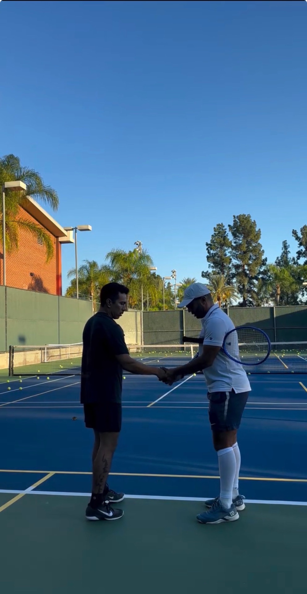 Coach and player shaking hands