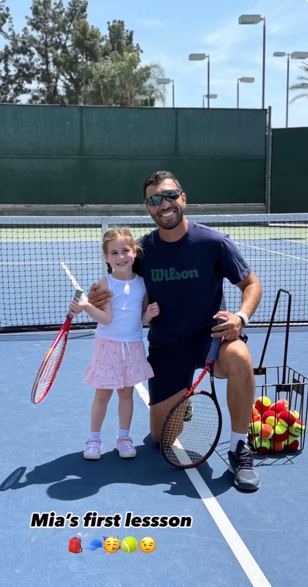 Mia's first tennis lesson with coach